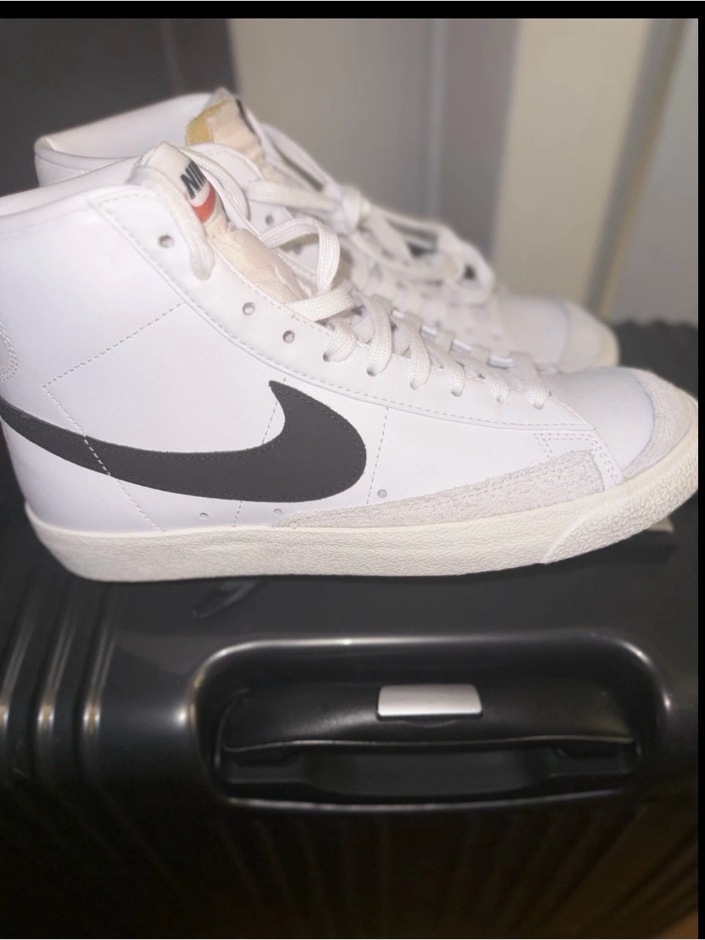 Nike White High-Top Sneakers with Black Swoosh Accent
